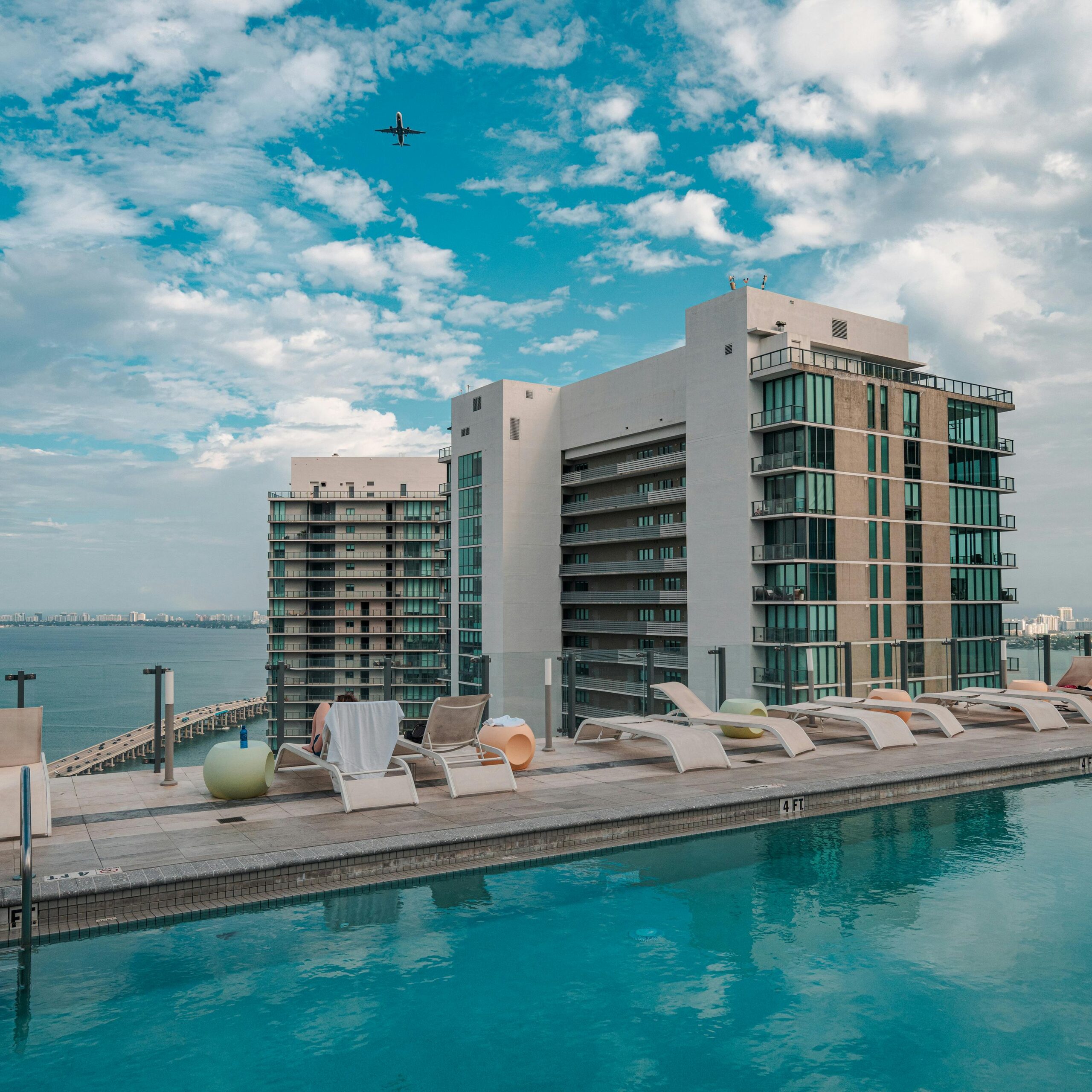 Modern rooftop pool with city view and clear sky in Miami, Florida.