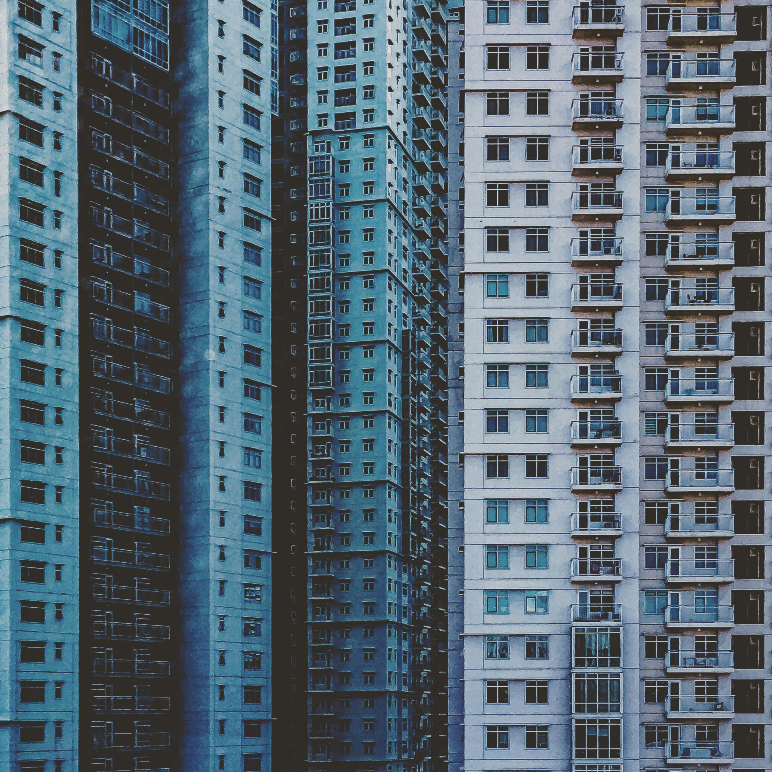 A close-up view of modern high-rise apartment buildings showcasing urban architecture.
